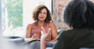 Health professional talking to a client