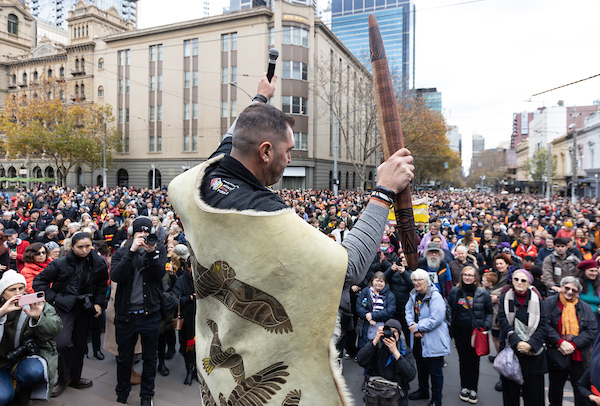 Kerrupmara Gunditjmara man Travis Lovett addresses the crowd from the steps of Parliament House.